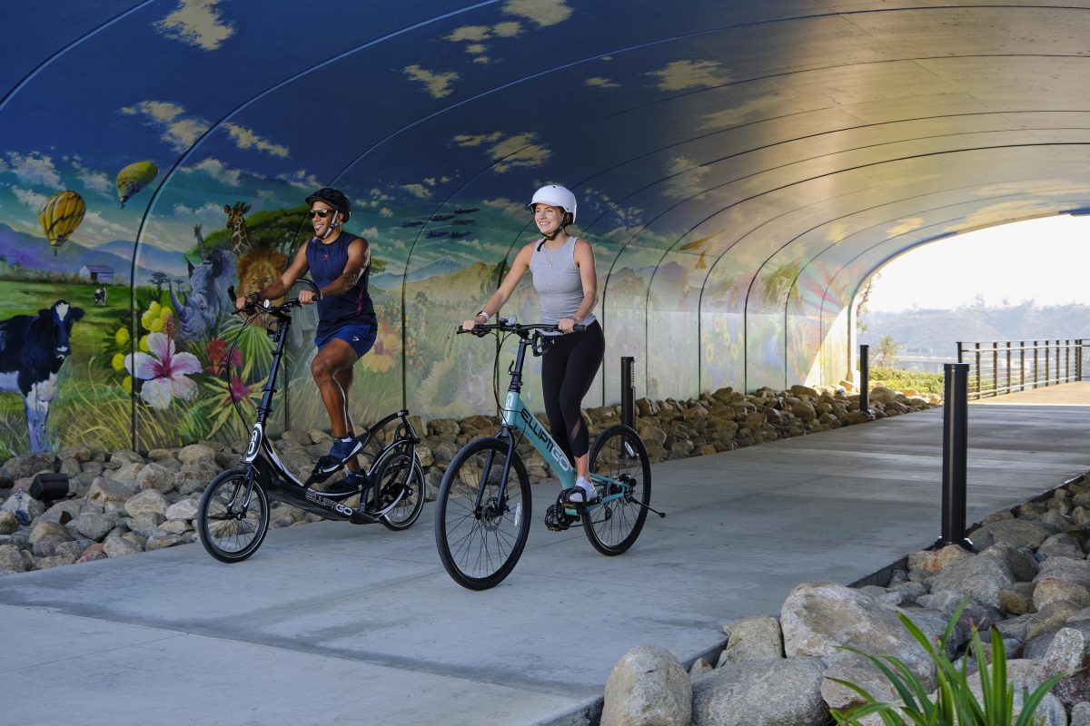 Two riders on different bikes, front